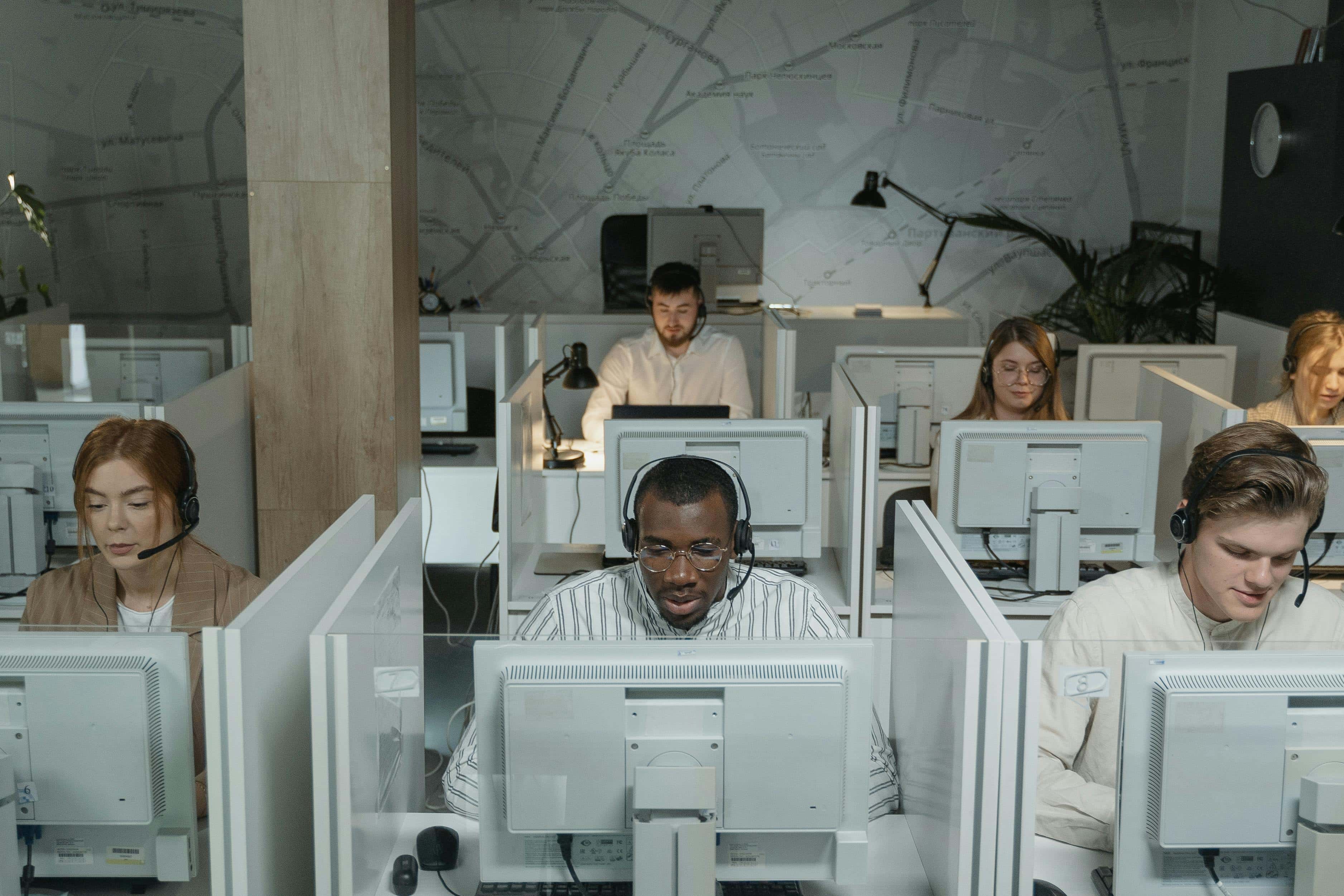 Support team working together in a call center office