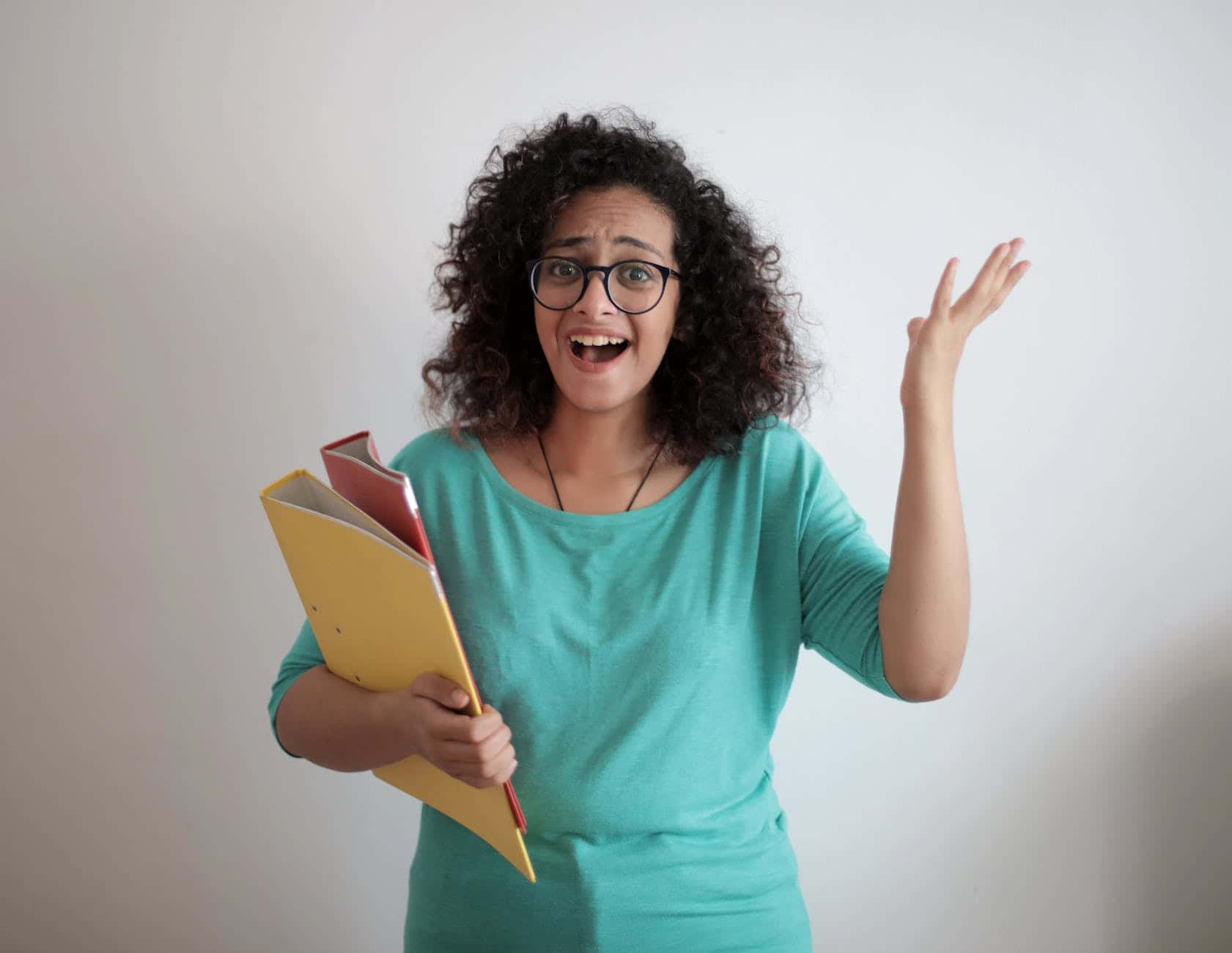 Frustrated support coordinator reviewing paperwork