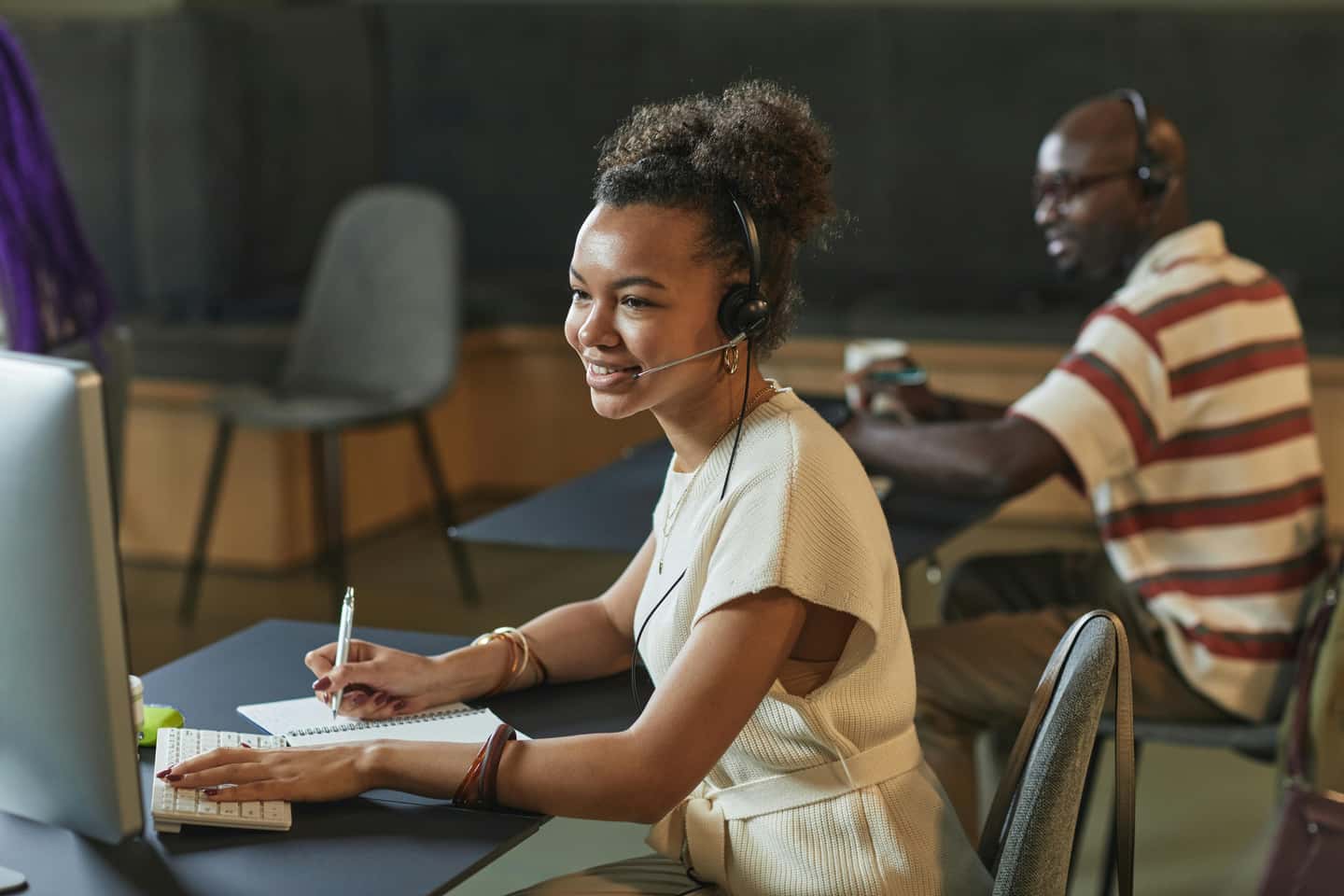 Call center agents coordinating responses at desks