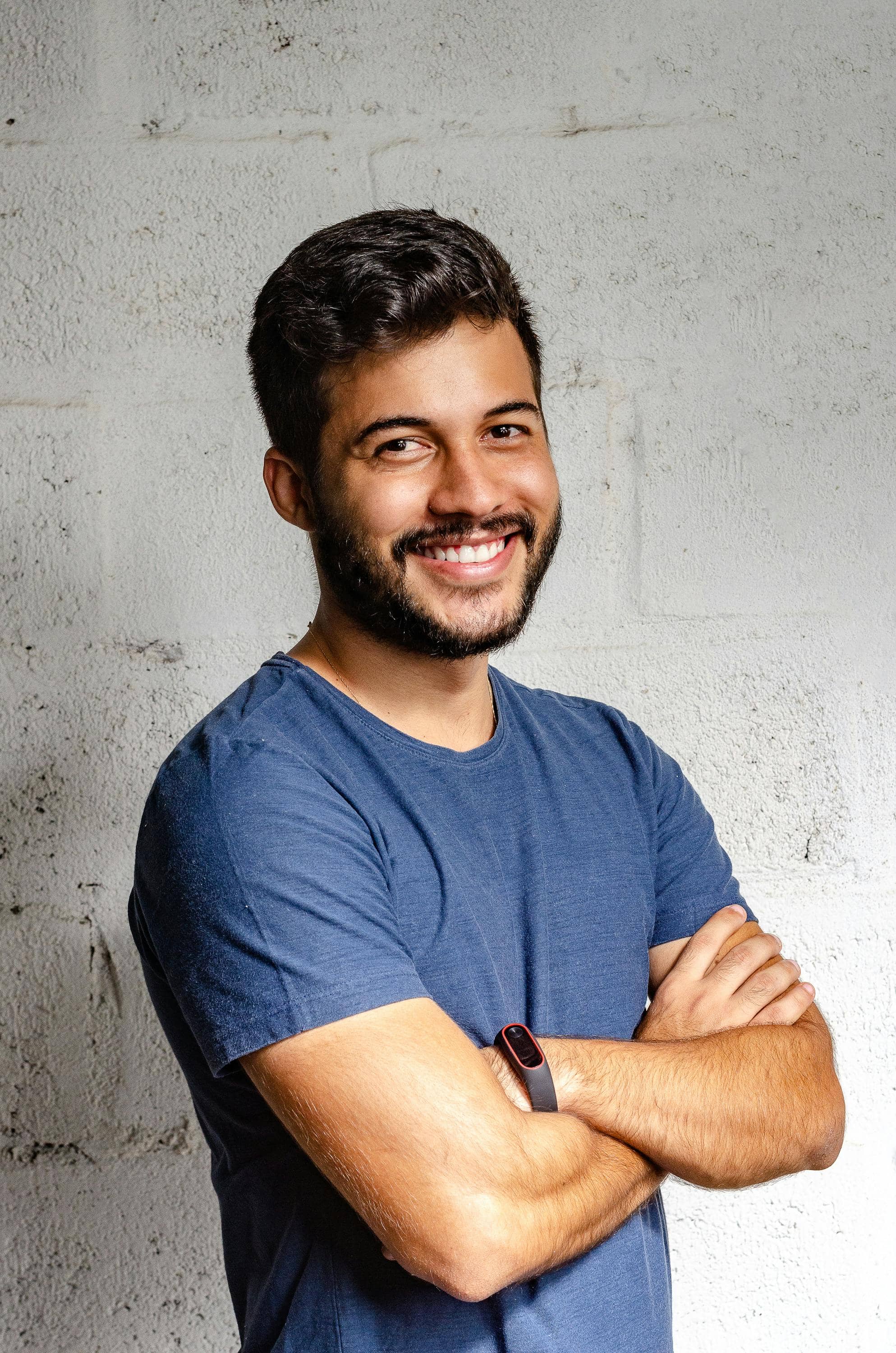 Smiling support professional with arms crossed